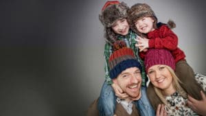 winter family portrait studio wearing wooly hats