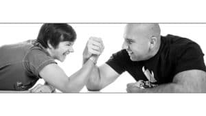 arm wrestleing couple black and white fun photoshoot studio portrait Crewe