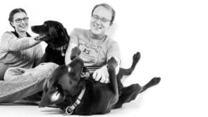 couples and pet photographer Knutsford Dogs laughing black and white portraits kids with pets