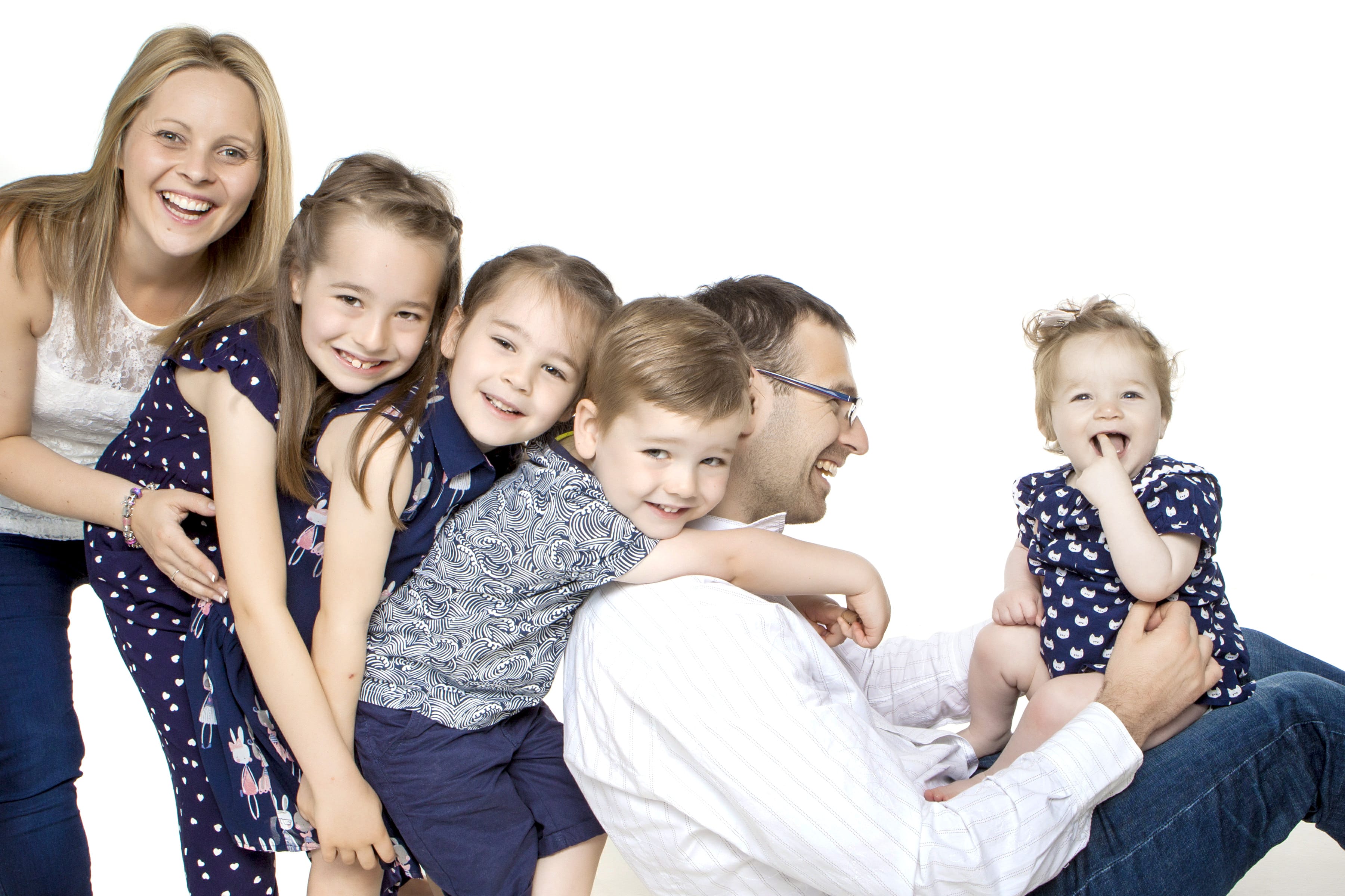 happy family with 4 kids taken at bartley studios