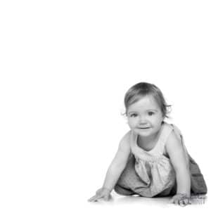 striking black and white portrait of a 1 year old in portrait studio