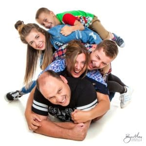 portrait photographers studio pile on family