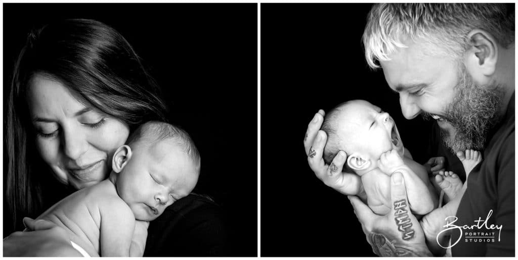 mum and dad holding baby asleep