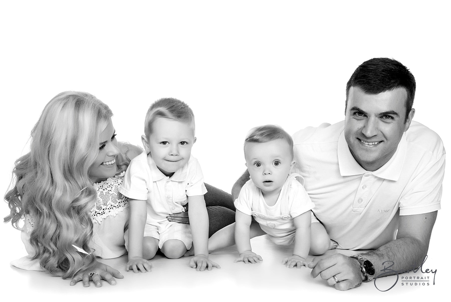 white tops family photograph takin in studio