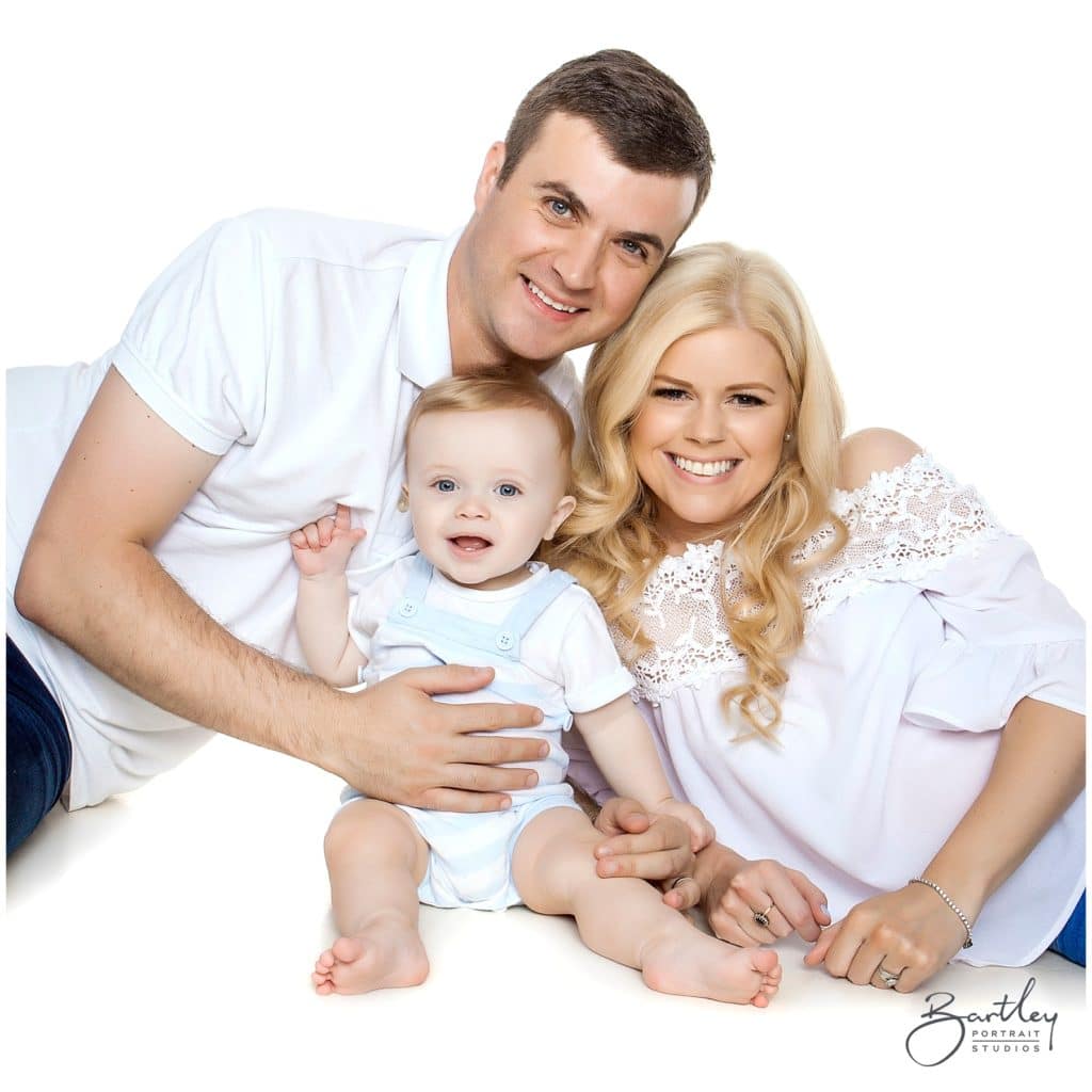 white tops family photograph takin in studio