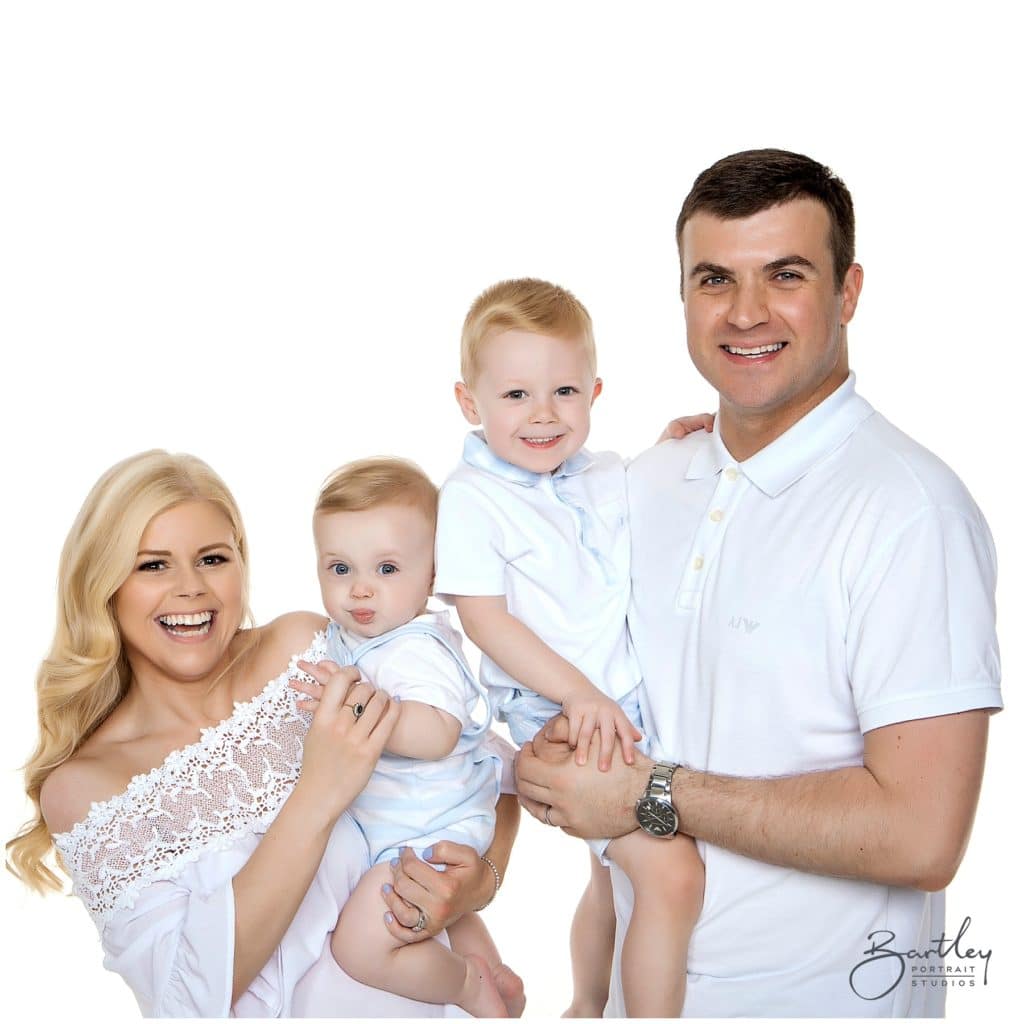 white tops family photograph takin in studio