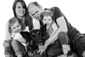 German Shepherd with family portrait