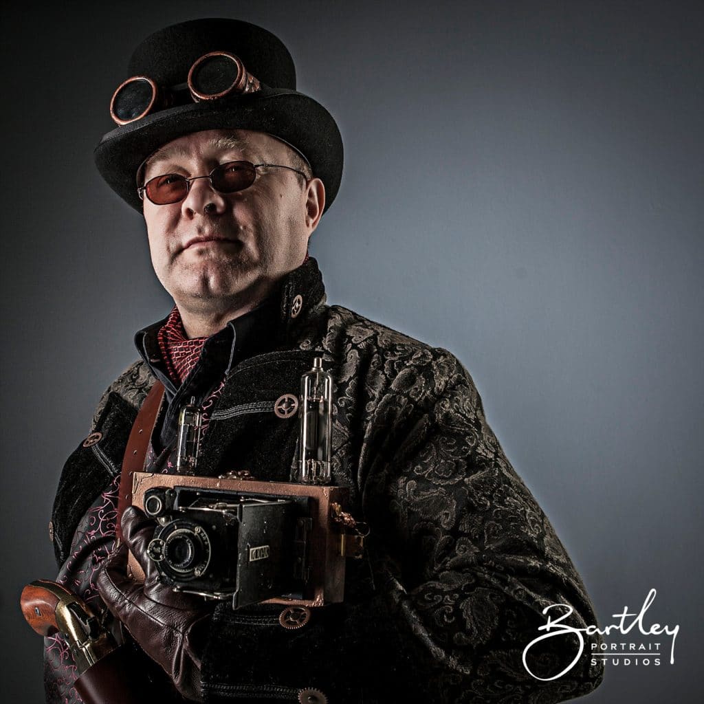 top hat and goggles with gun steam punk