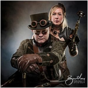 couple with goggles and unbrella steam punk style