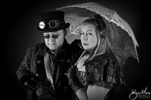 couple with goggles and unbrella steam punk style
