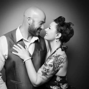 love smiling couple black and white portrait studio shoot tattoos vintage