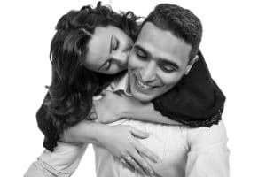 couple kissing studio portrait black and white smiling happy natural warrington