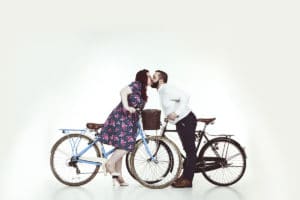 couple kissing on bikes vintage cute love studio photo shoot